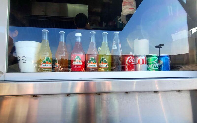 Jarritos and Mexican Coke lined up in the truck window